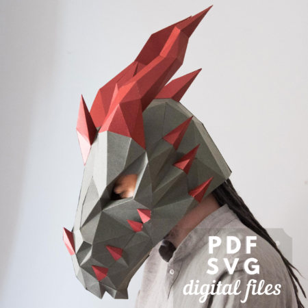 Grey and red dragon mask made of paper.